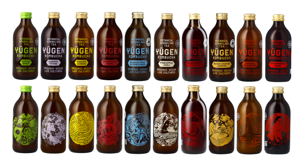 Variety of Yugen Kombucha bottles with illustrated labels, featuring flavors such as Apple Mint, Cherry Thyme, Ginger Lemon, Grapefruit Hops, Passion Fruit Elderflower, Pineapple Chili, Raspberry Cacao, Blood Orange Juniper, Mango Turmeric, and Strawberry Basil, all emphasizing organic and vegan qualities.